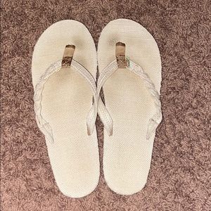 Cream flip flops